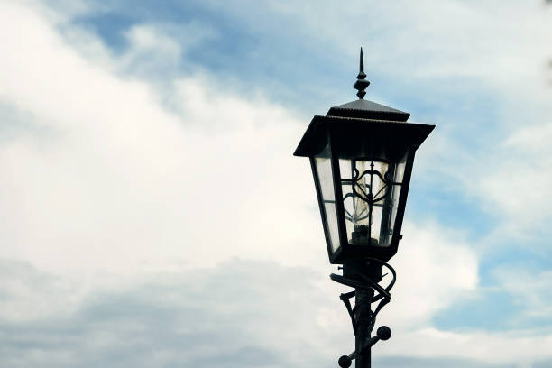 istock Antique Street Light isolated on a blue sky background. 1141357031