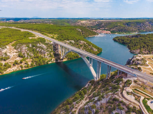 istock highway bridge cross river with blue water. summer time 1141357350