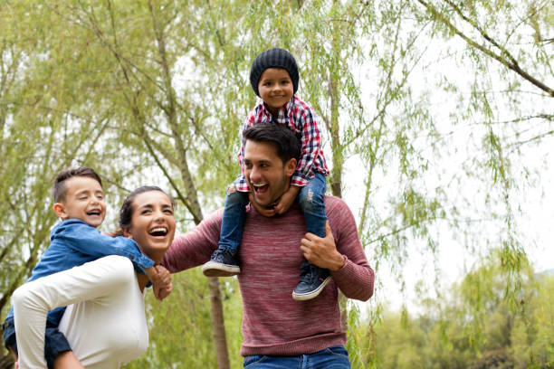 istock Family has fun playing in the field 1141360307