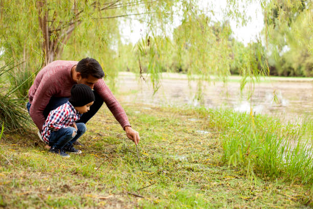 istock Family walking through field on a spring day 1141361511