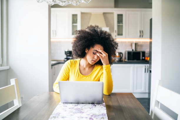 istock Depressed woman at home 1141362557