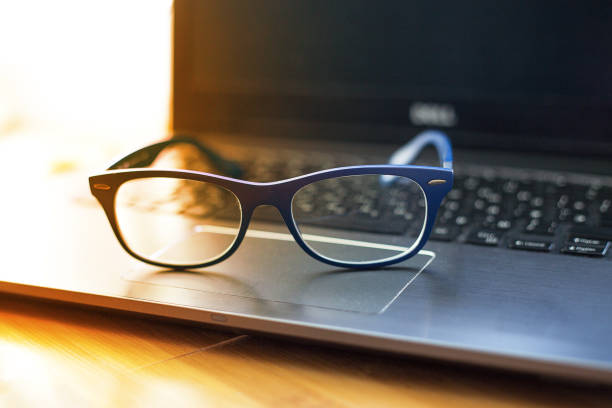istock spectacles on a laptop on a wooden table 1141363107