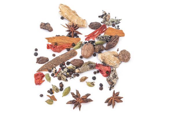GARAM MASALA ALL TYPE OF GARAM MASALA ARRANGED TOGETHER ON A WHITE BACKGROUND ayurveda cardamom star anise spice stock pictures, royalty-free photos & images