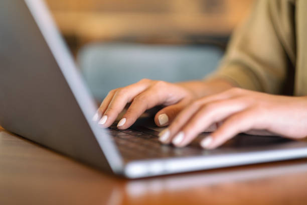 istock Closeup image of woman's hands using and typing on laptop computer keyboard 1141366932