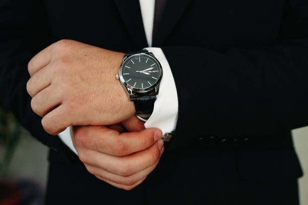 istock A man in a blue suit straightens his sleeves 1141366998
