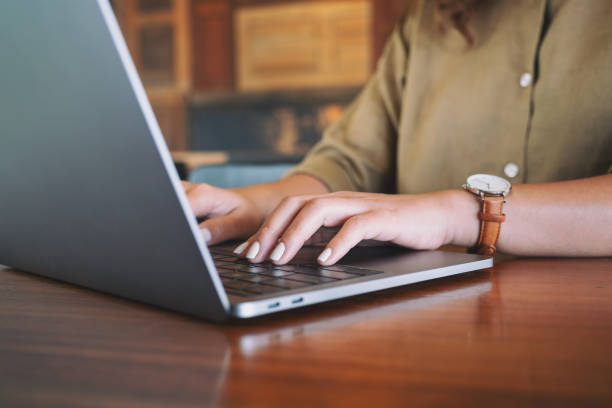 istock Closeup image of woman's hands using and typing on laptop computer keyboard 1141367028