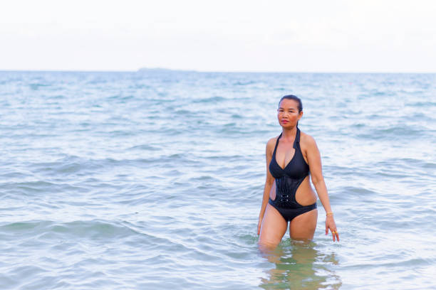 istock Woman shape huge sexy with bikini black on beach 1141368843