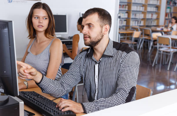 istock Female and male students working on computers 1141370192