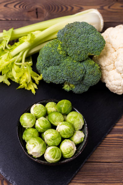 istock Top view on cabbage, broccoli, cauliflower, Brussels sprouts and celery - the concept of vegetarian food. 1141371383