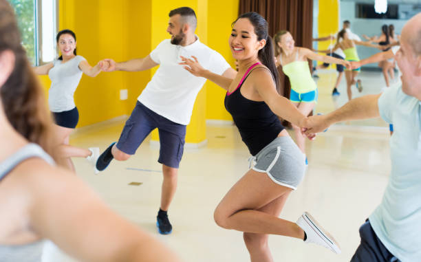 istock Girl is dancing rock-n-roll with partner 1141371618