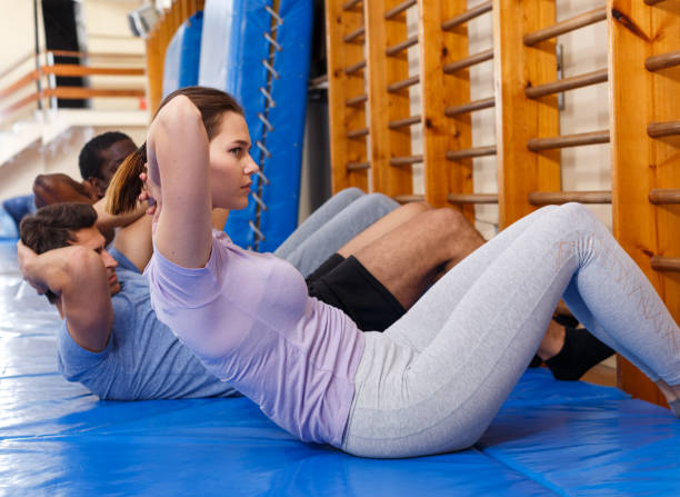 istock People warming up at gym 1141371875