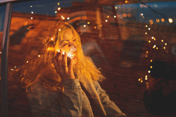 istock Woman using phone in car 1141373396