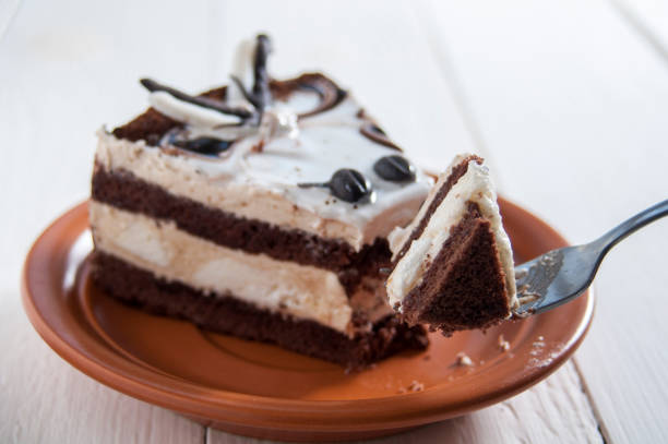 istock Delicious cake. Dessert on plate on white wooden table. 1141373852