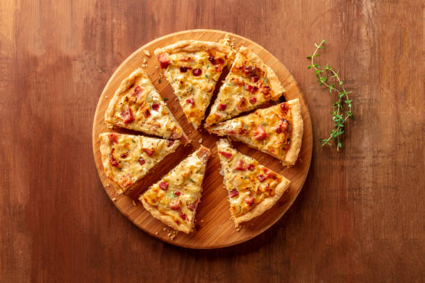 istock A quiche lorraine with thyme, shot from above on a dark rustic wooden background with copy space 1141376712