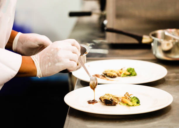istock Chef preparing food, meal, in the kitchen, chef cooking, Chef decorating dish 1141376825