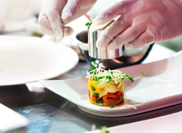 istock Chef preparing food, meal, in the kitchen, chef cooking, Chef decorating dish 1141376835