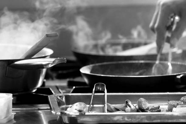 istock Chef preparing food, meal, in the kitchen, chef cooking, Chef decorating dish 1141376836