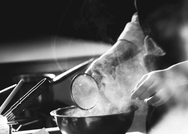 istock Chef preparing food, meal, in the kitchen, chef cooking, Chef decorating dish 1141376844