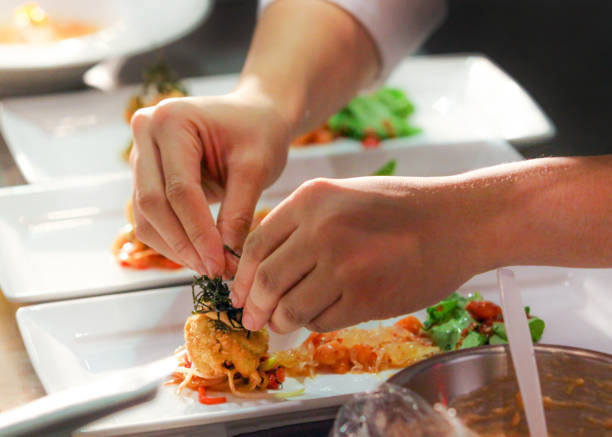 istock Chef preparing food, meal, in the kitchen, chef cooking, Chef decorating dish 1141376847