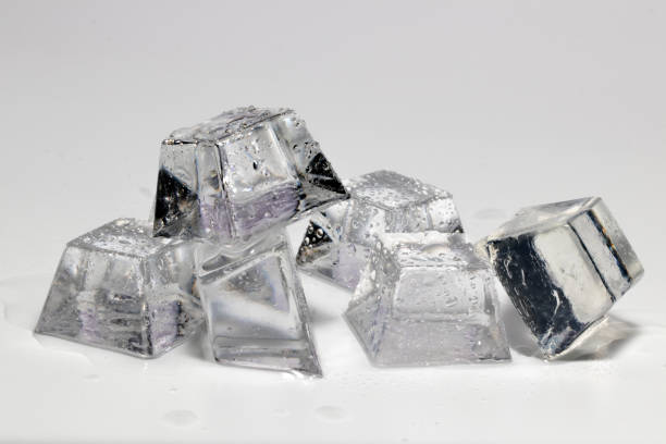 istock Transparent ice cubes melted on a white background. 1141381254