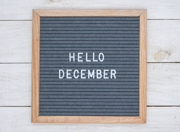 istock English text Hello December on a letter Board in white letters on a gray background 1141381324