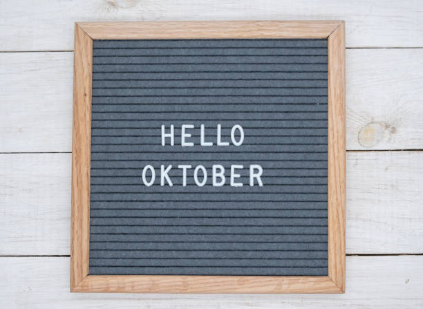istock English text Hello October on a letter Board in white letters on a gray background 1141381334
