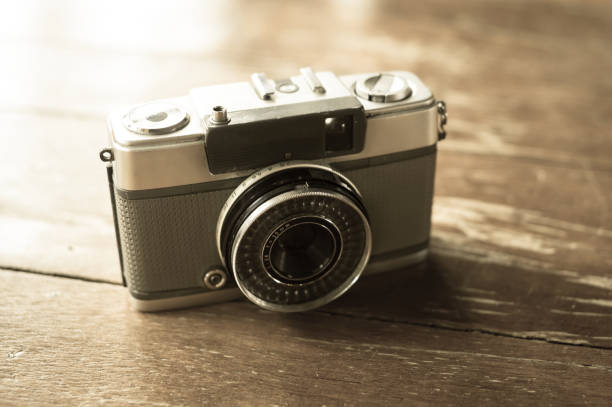 istock Retro old film camera on table. 1141381665