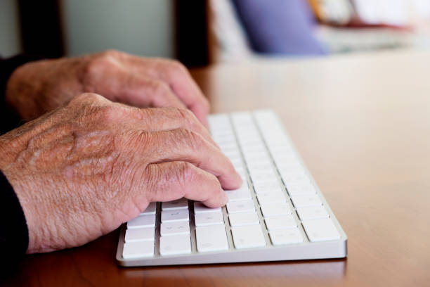 istock old caucasian man typing in a keyboard 1141382563