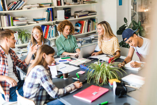 istock Large group of students preparing for their exams together in a library. 1141389931