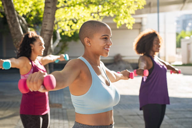 istock Three curvy women exercising with dumbbells 1141391857