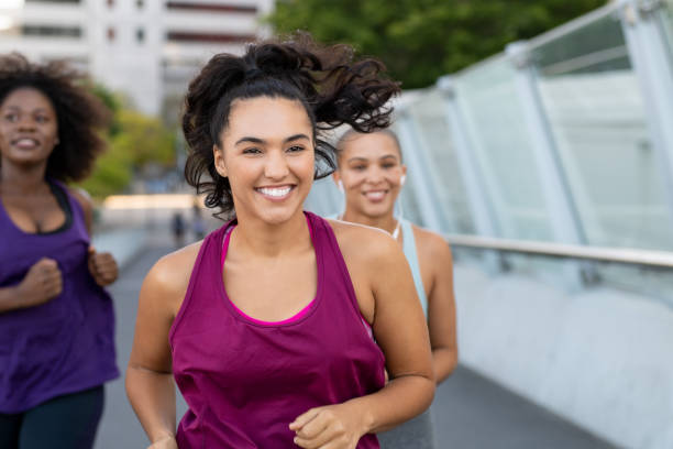 istock Cheerful latin woman jogging 1141392216