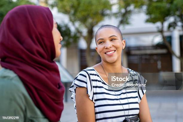 Muslim Woman With Friend Stock Photo - Download Image Now - Discussion, Talking, Friendship