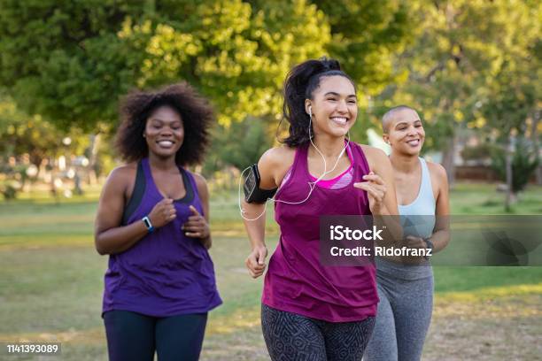 Active Curvy Women Jogging Stock Photo - Download Image Now - Exercising, Women, Running