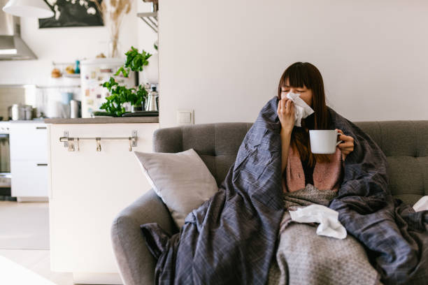 istock Asian woman sick at home with common cold 1141394505