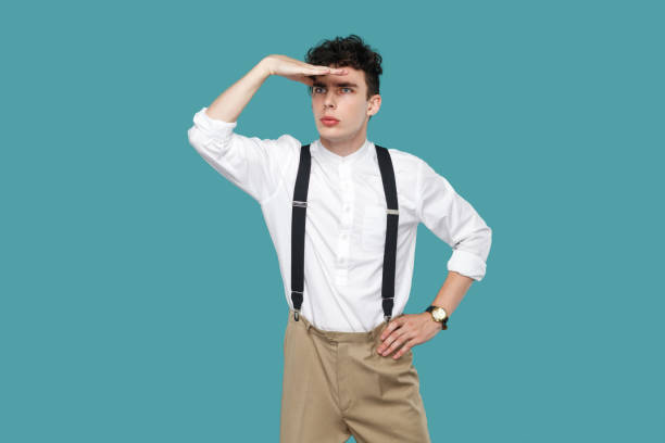 istock Attentive man looking to far with hand on forrhead. 1141396831