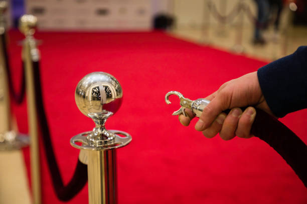 red carpet Red carpet with barriers and velvet ropes. premiere event stock pictures, royalty-free photos & images