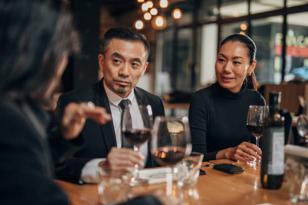 istock Elegant business people in restaurant 1141397441