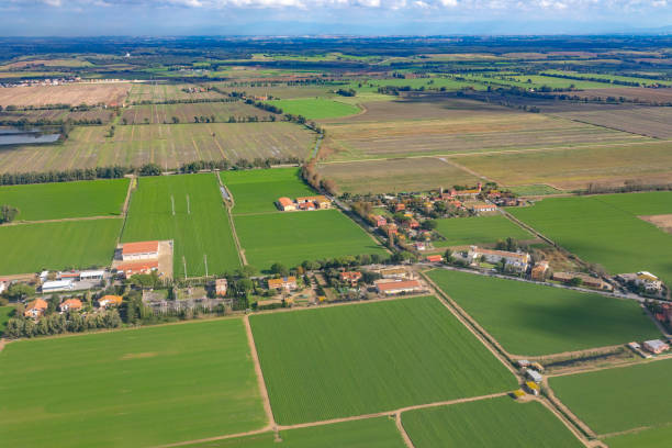 istock Aerial view on the fields and houses in Italy 1141398144
