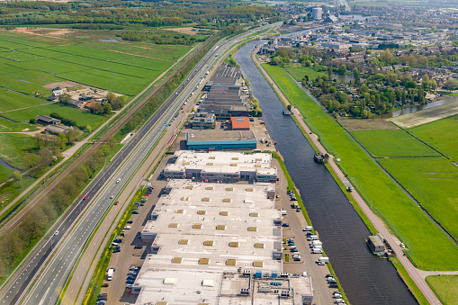 Top view on storage buildings near amelioration canals, Netherlands.