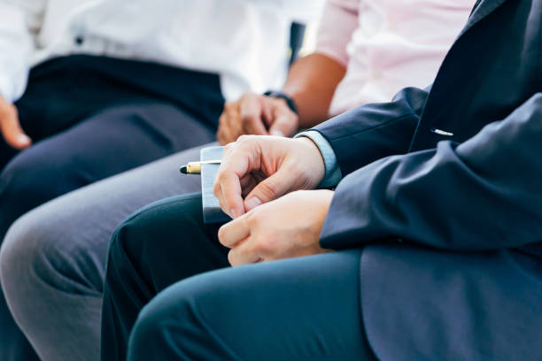 Businessman hands alongside with other businessmen Close-up of businessman hands being nervous and anxious preparing for tension and pressure Phobia stock pictures, royalty-free photos & images