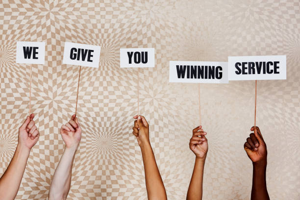 istock Raised hands hold signs 