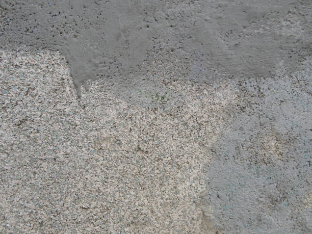 istock Gray plastered wall with a glass crumb background texture 1141401913