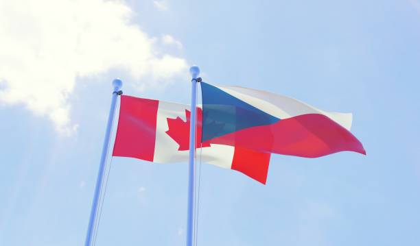 istock Czech Republic and Canada, two flags waving against blue sky 1141401980