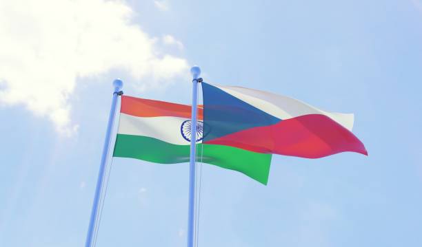 istock Czech Republic and India, two flags waving against blue sky 1141402627