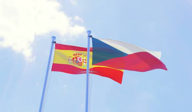 istock Czech Republic and Spain, two flags waving against blue sky 1141402720