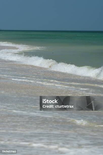 Surf Along Beach With Turquoise Sea And Small Waves Stock Photo - Download Image Now
