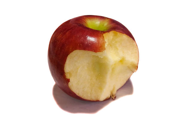 istock Red bitten apple close up isolated on white background 1141403238