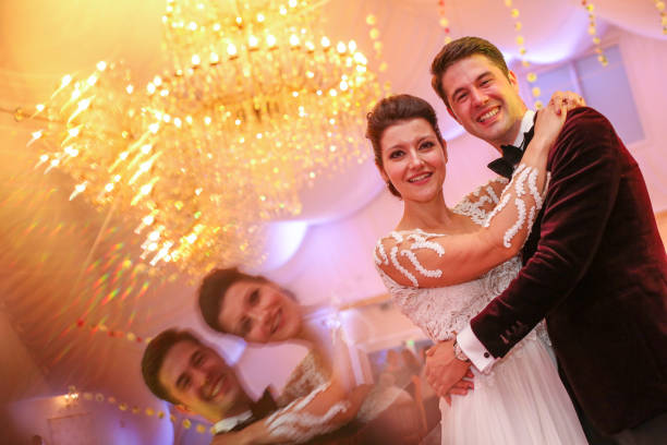 istock Happy wedding couple posing in restuarant 1141403385