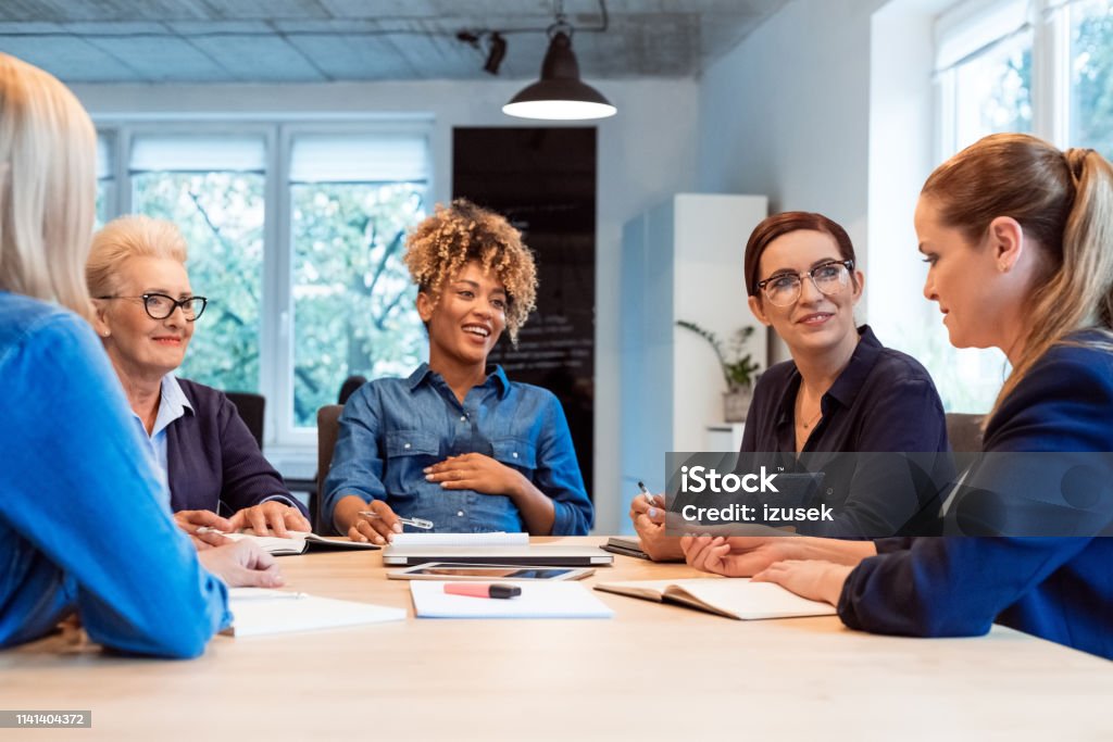 Confident owners planning new business strategies Confident owners planning new business strategies at desk. Businesswomen are working in office. They are running start-up business. Desk Stock Photo