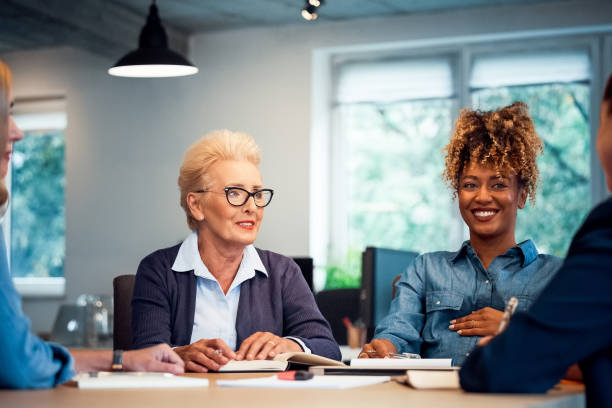 istock Smiling entrepreneurs discussing new business plan 1141404784